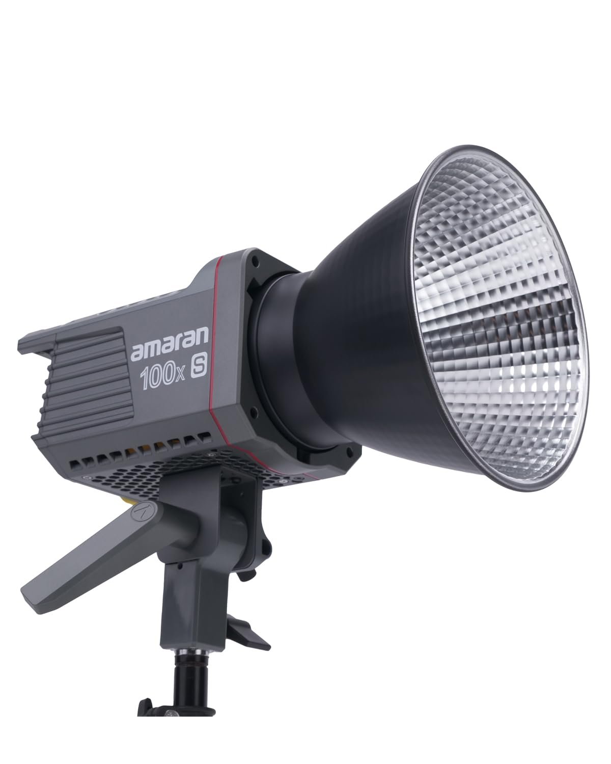 Aputure Amaran 100x S LED light with a softbox modifier, illuminating a subject in a professional video production setup, highlighting its versatility.