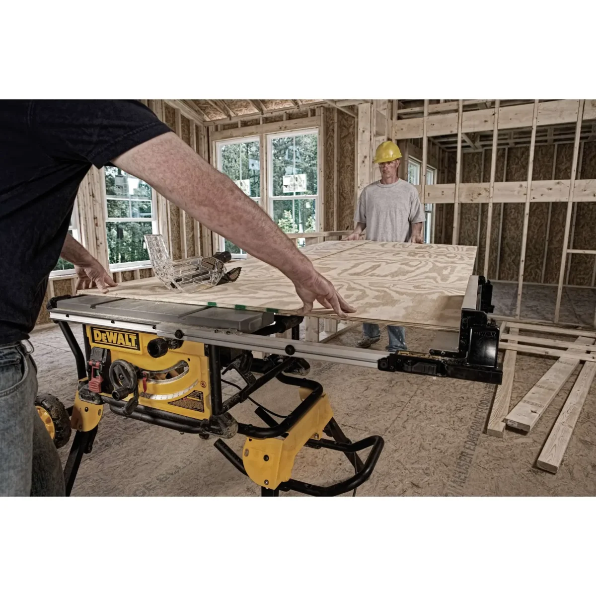 DEWALT DWE7491RS 10-Inch Jobsite Table Saw with its integrated rolling stand, showcasing its robust design and portability on a white background.
