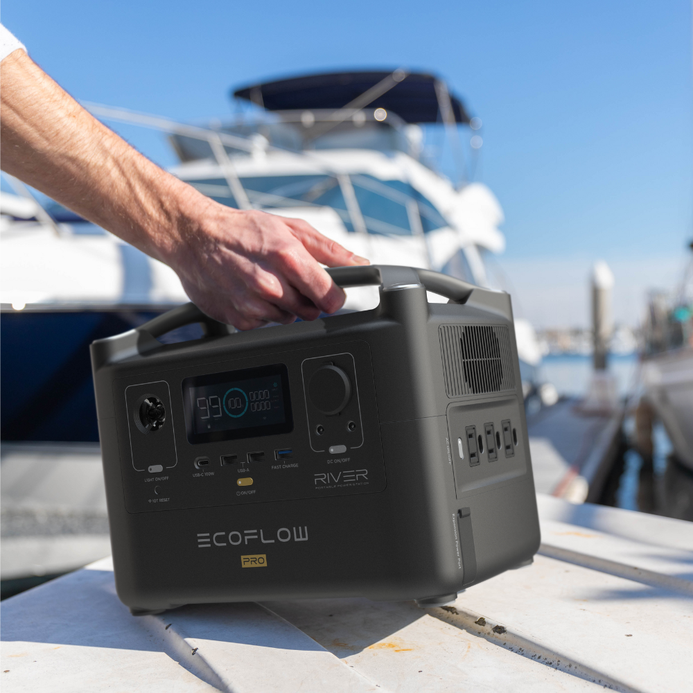EcoFlow RIVER Pro 2025 Edition being used outdoors by a content creator, powering a laptop and camera equipment on a picnic table, highlighting its portability and real-world application.