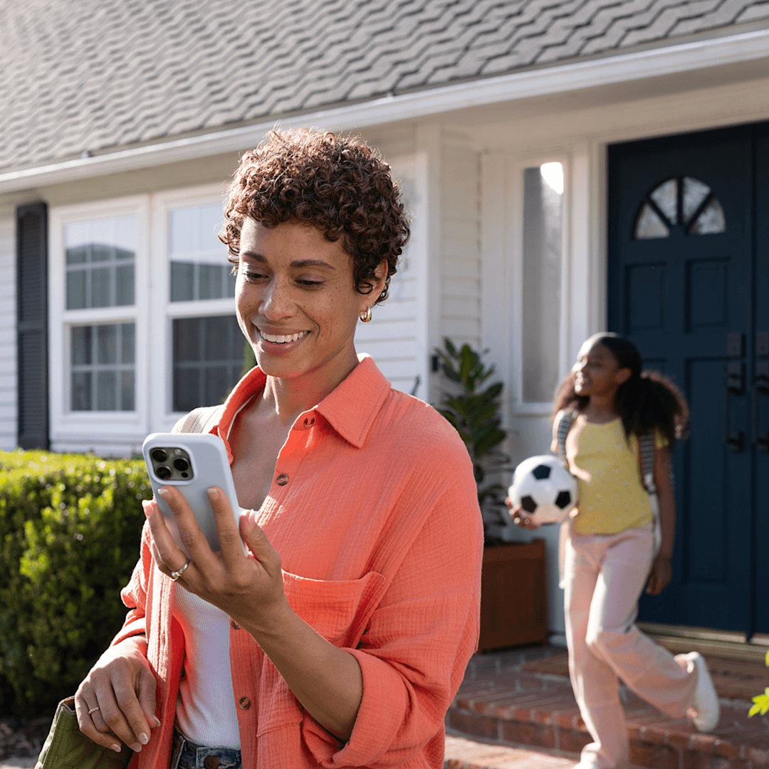 A modern living room with the Ecobee 3 Lite Smart Thermostat mounted on the wall, seamlessly blending into the home's decor and providing comfortable climate control.