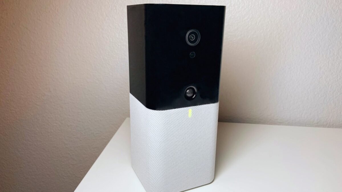 The Abode Iota All-In-One Security Kit positioned discreetly in a modern living room, demonstrating its seamless integration into a smart home environment.